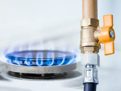 gas pipe with open yellow valve and burning gas burner, double exposure of natural gas use